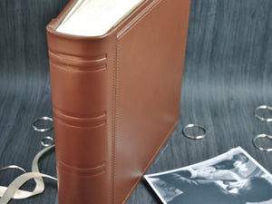 spine of a brown photo album by Giovelli Design