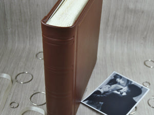 spine of a brown leather scrapbook by Giovelli Design