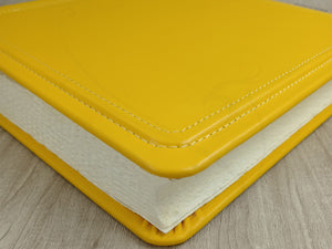 particular of a fancy yellow photo book by Giovelli Design