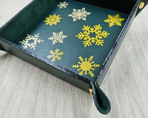 shining gold foiled snowflakes on a leather valet tray by Giovelli Design