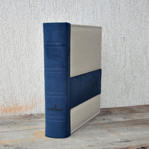 spine of a fancy beige and blue photo album by Giovelli Design