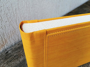 fancy finishes and seams of a stunning yellow giovelli design album