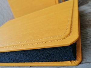 fancy finishes and seams of a stunning yellow giovelli design album with black pages