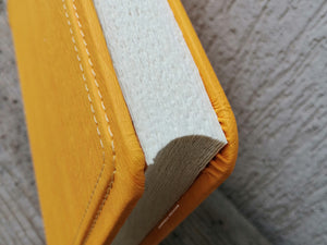 stylish finishes and seams on a yellow non leather album by Giovelli Design