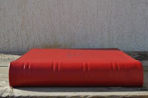 red leather photo album on a table by Giovelli Design