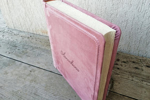 Picture from above of an enchanting pink photo album by Giovelli Design