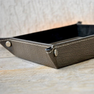 elegant finishes and metal studs on a leather valet tray by giovelli design