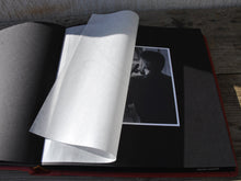 Carica l&#39;immagine nel visualizzatore di Gallery, opened album with black pages and protective tissue
