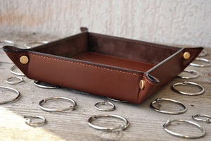 stylish finishes and classy gold metal studs on a brown leather catchall by Giovelli Design